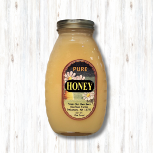 raw honey in a classic glass jar