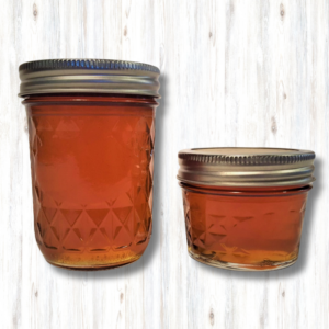 two mason jars of maple jelly